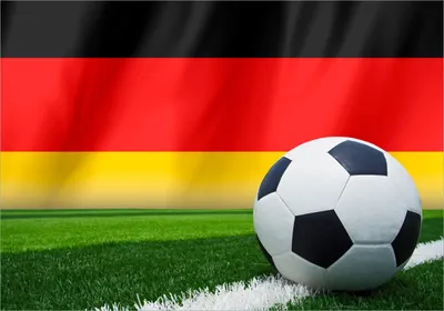 Produktbild von Wallario Poster - Fußball vor einer Deutschlandflagge, Kunstdruck Größe: 70 x 100 cm