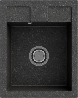 A top-down view of a black granite kitchen sink with a drain.