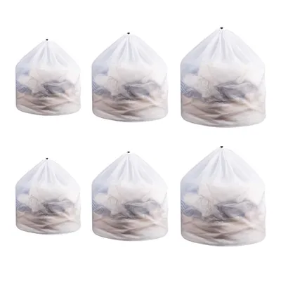 Six laundry bags filled with laundry, arranged in two rows of three.