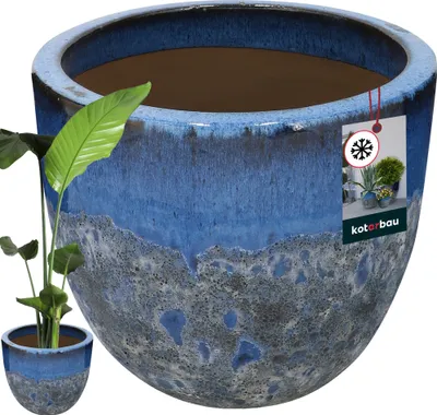 A large, blue and gray ceramic planter with a plant inside, shown against a white background. A product tag is attached to the planter.
