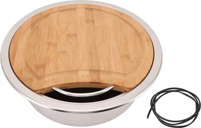 A stainless steel sink with a bamboo cutting board insert and a black rubber cord.