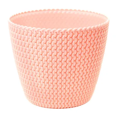 A pink knitted-look plant pot on a white background.