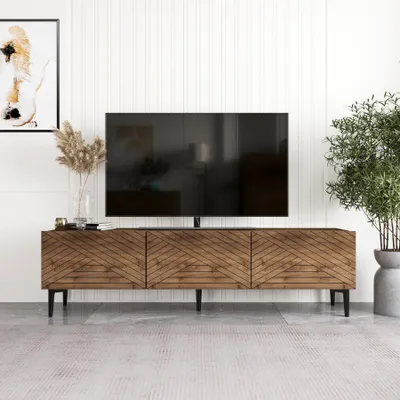 A modern living room with a TV stand and a large television.