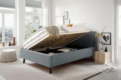 Produktbild von Meise Möbel Stauraumbett Frieda 140x200 cm | Bettkasten & Lattenrost | Webstoff Eisblau | Holzfuß schwarz