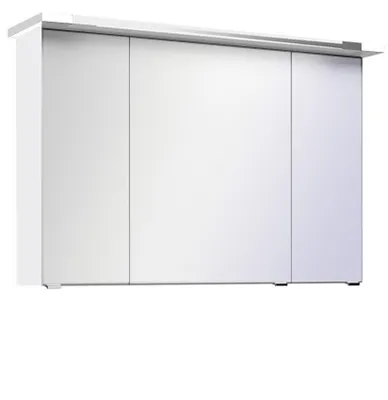 A white cabinet with three doors and a light fixture above.