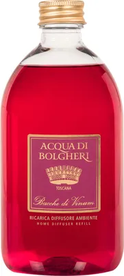 A clear studio shot of a bottle of red liquid with a label.