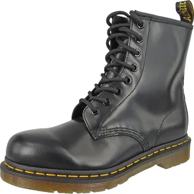 A black Dr. Martens boot on a white background.