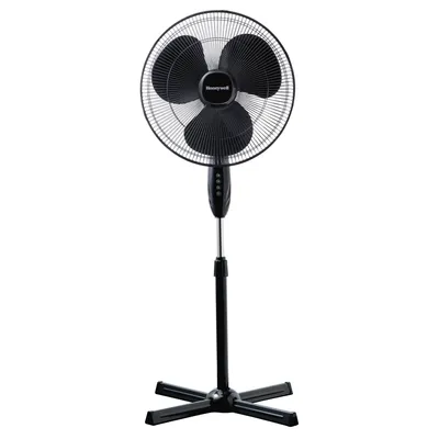 A black Honeywell stand fan against a white background.