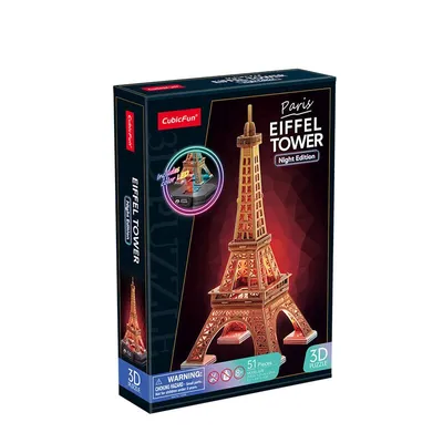 A product box for a 3D Eiffel Tower puzzle, night edition.