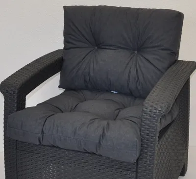 A close-up view of a dark gray cushion set for PE rattan furniture, placed on the furniture itself.