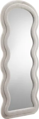 A full-length mirror with a wavy, textured frame.