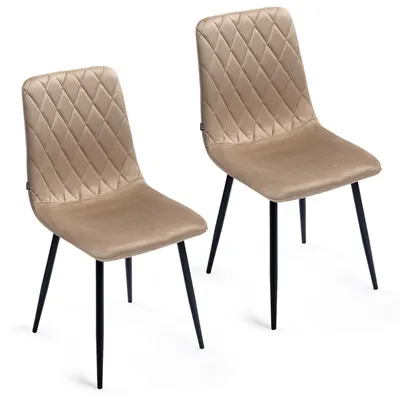 Two beige upholstered dining chairs with black metal legs are shown against a white background.