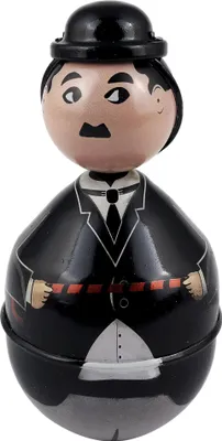 A toy figurine of Charlie Chaplin, a roly-poly toy.