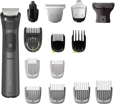 A collection of a Philips hair clipper and its various attachments, laid out on a white background.