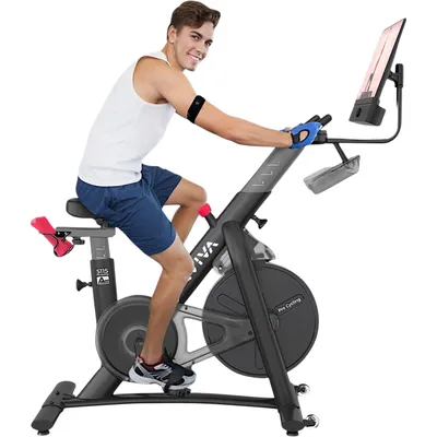 A man is riding an indoor exercise bike.