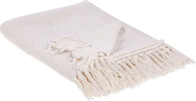 A folded beige throw blanket with fringe detail, presented on a white background.
