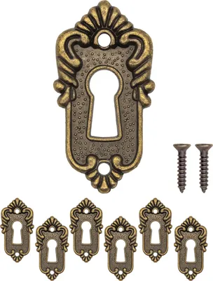 A collection of antique-style keyhole escutcheons and screws on a white background.