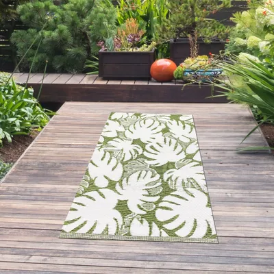 Produktbild von Exotischer Outdoor-Teppich mit tropischen Blättermotiven in Grün Größe - 90 x 150 cm