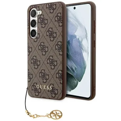 A brown Guess phone case with a gold charm is shown against a white background.