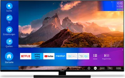 A television screen displaying a mountain landscape and a user interface with app icons and menu options.