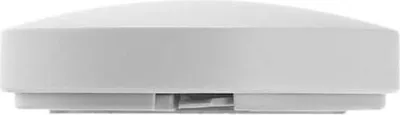 A side view of a white smart home hub.
