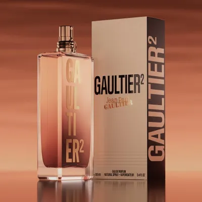 A bottle of Jean Paul Gaultier Gaultier 2 perfume and its box are displayed against a gradient background.