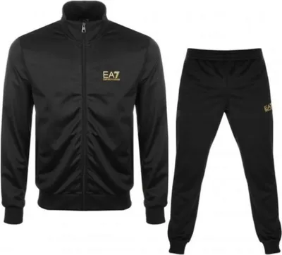 A black tracksuit with a gold logo is displayed against a white background.