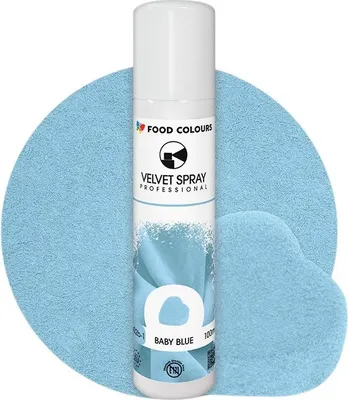 A spray can of food coloring is shown against a background of blue powder.
