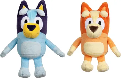 Two stuffed animal dogs, Bluey and Bingo, are standing side-by-side against a white background.