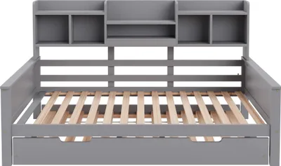 A gray wooden daybed with a built-in shelf unit at the headboard, shown from the front.