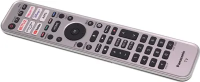 A silver remote control with various buttons and app icons is shown against a white background.