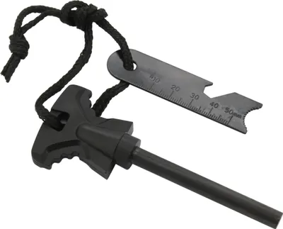 A black fire starter with a metal scraping tool attached by a cord, isolated on a white background.