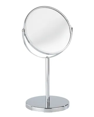 A silver-colored cosmetic stand mirror with a round reflective surface and a circular base, shown against a white background.