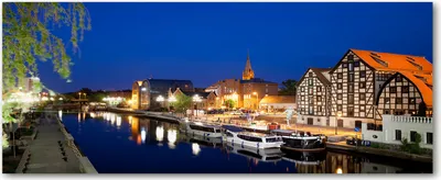 Produktbild von Tulup® Glas-Bild Wandbild aus Glas - 125x50 - Wandkunst - Wandbild hinter gehärtetem Sicherheitsglas - Dekorative Wand für Küche & Wohnzimmer  - Sehenswürdigkeiten & Architektur - Bromberg bei Nacht - Blau
