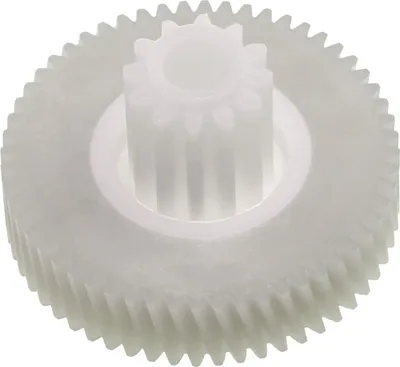A white plastic gear with two sets of teeth.