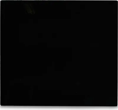 A black glass plate, likely a cooktop cover or backsplash.