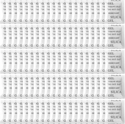 Multiple rows of silica gel packets with text printed on them.