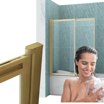A woman is taking a shower in a bathtub with a shower enclosure.