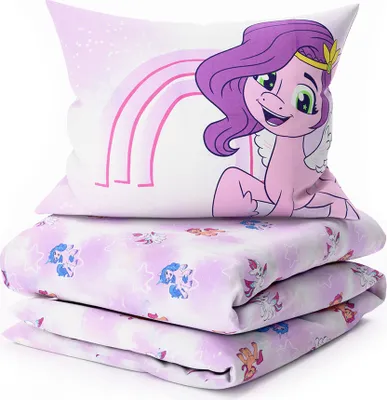 A stack of folded bedding with a pillow on top, featuring My Little Pony characters and a rainbow.