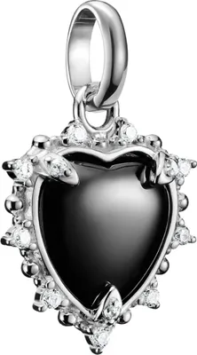 A close-up studio shot of a heart-shaped pendant with black enamel and surrounding clear stones.