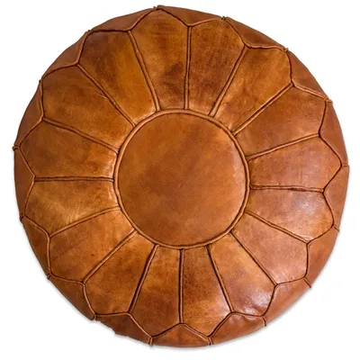 A top-down view of a Moroccan-style leather pouf.