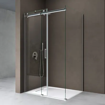 A modern shower cabin with a sliding door, featuring a shower head and controls, set against a textured brown wall and a light gray floor.