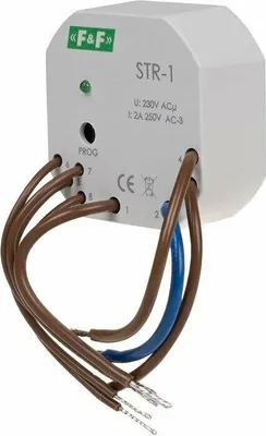 A white electrical device with wires attached, shown against a white background.