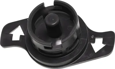 A close-up shot of a black plastic component with a central cylindrical protrusion and two arrow-shaped extensions on the sides.