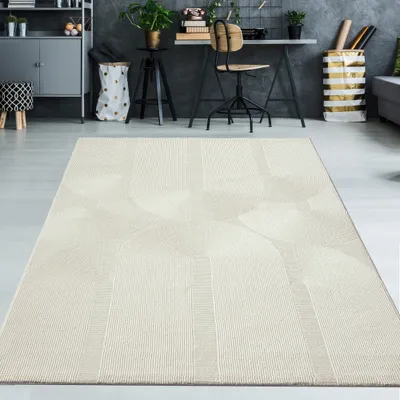 A modern office or living space with a desk, chair, and shelving unit, featuring a cream-colored rug with an abstract pattern in the foreground.
