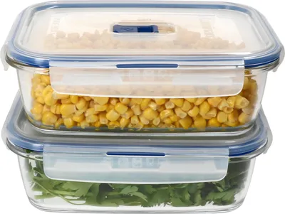 Two glass food storage containers stacked on top of each other, filled with food.