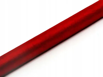 A roll of red organza fabric is shown diagonally against a white background.