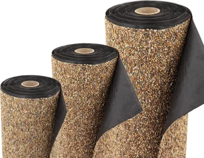 Three rolls of material with a pebble-like texture on one side and a black backing on the other, arranged diagonally.