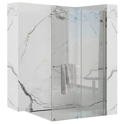A modern shower enclosure with marble-effect walls and a towel hanging on a rack.