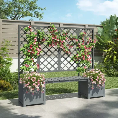 A garden bench with planters and a trellis, adorned with climbing plants and flowers.